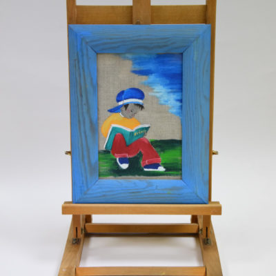 zaczytany chłopiec płótno w ramie 33x26 cm